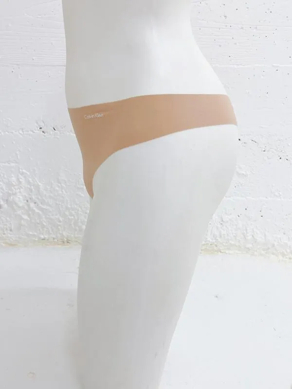 Calvin Klein Women's Invisibles 5 Pack Seamless Thong Light Caramel QD3556 274